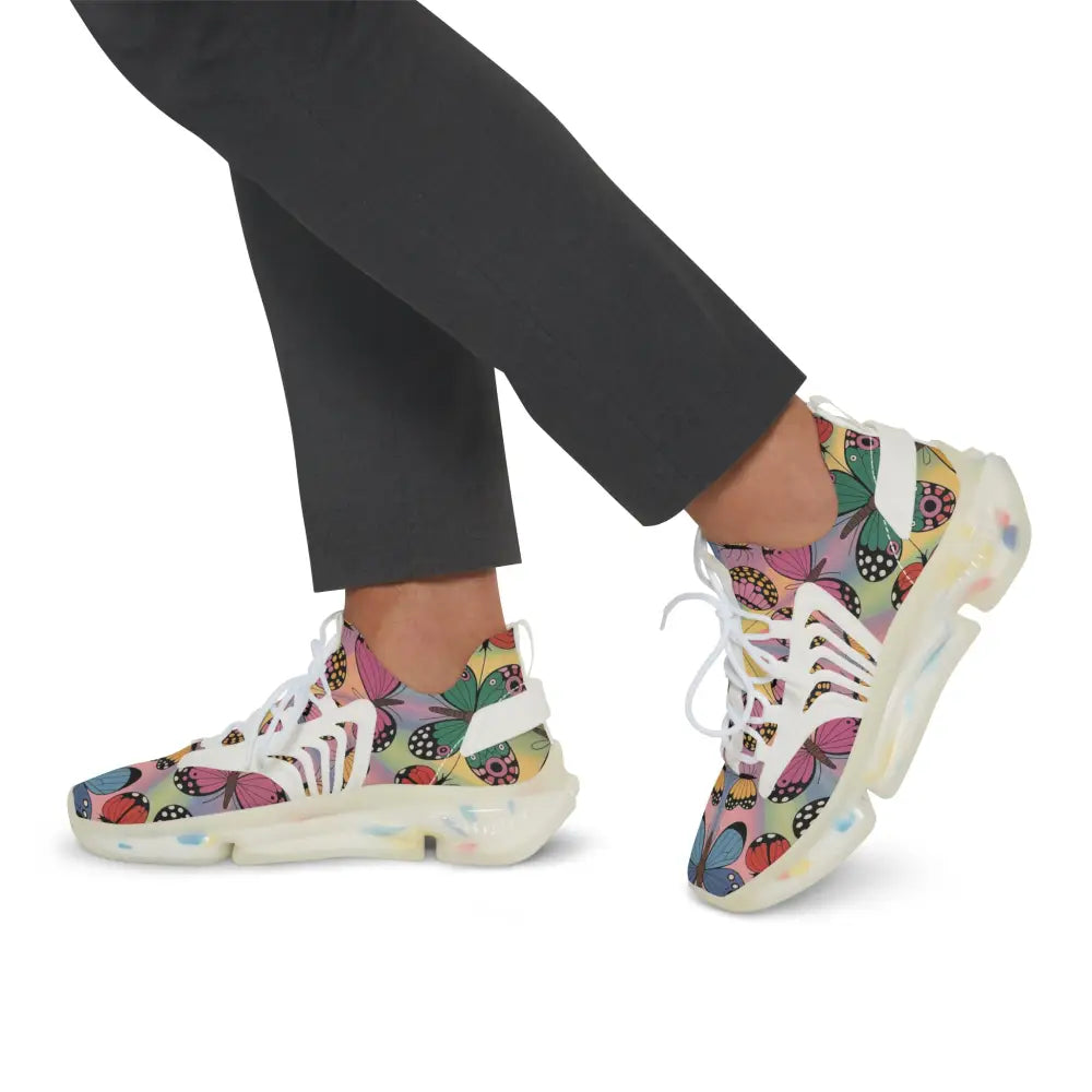 Kaleidoscope Flight sneakers with colorful butterfly pattern, white laces, clear soles