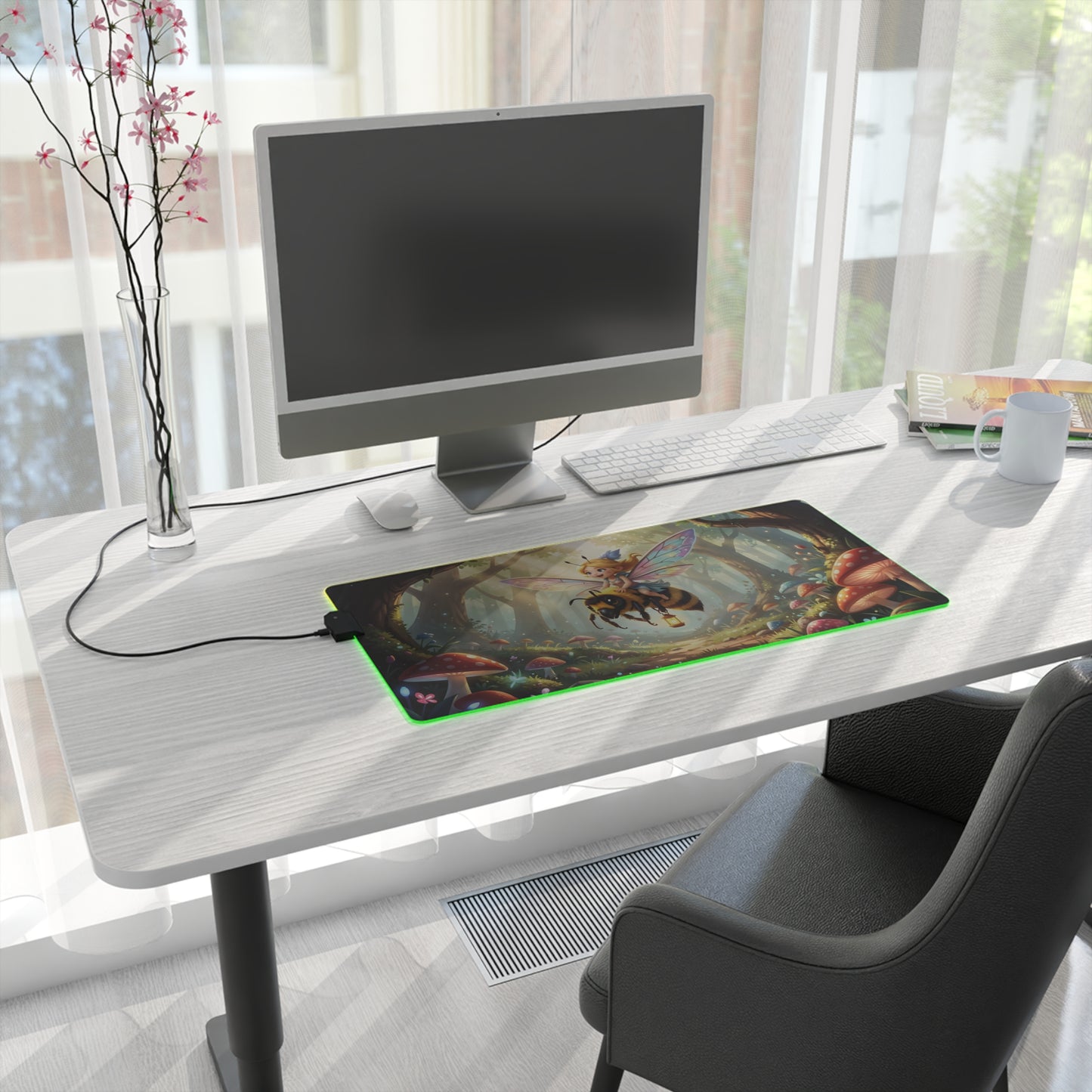 LED gaming mouse pad with fairy bee forest design and green RGB strip in a home office.