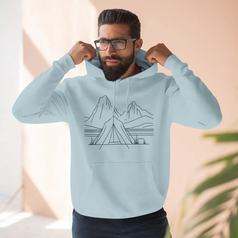 Light blue unisex hoodie with mountain and tent line art, featuring luxurious fleece and spacious kangaroo pocket