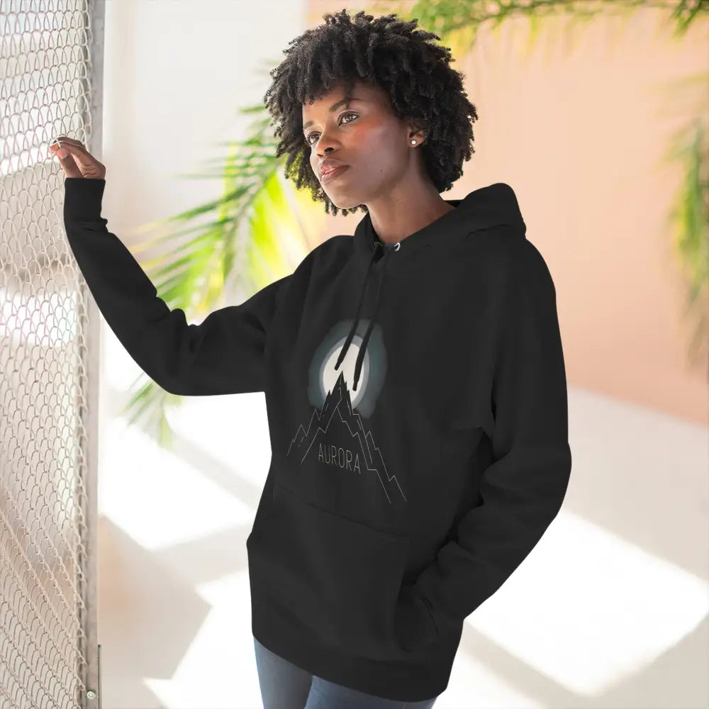 Black hoodie with mountain and moon graphic, machine wash low heat, cozy outdoor wear