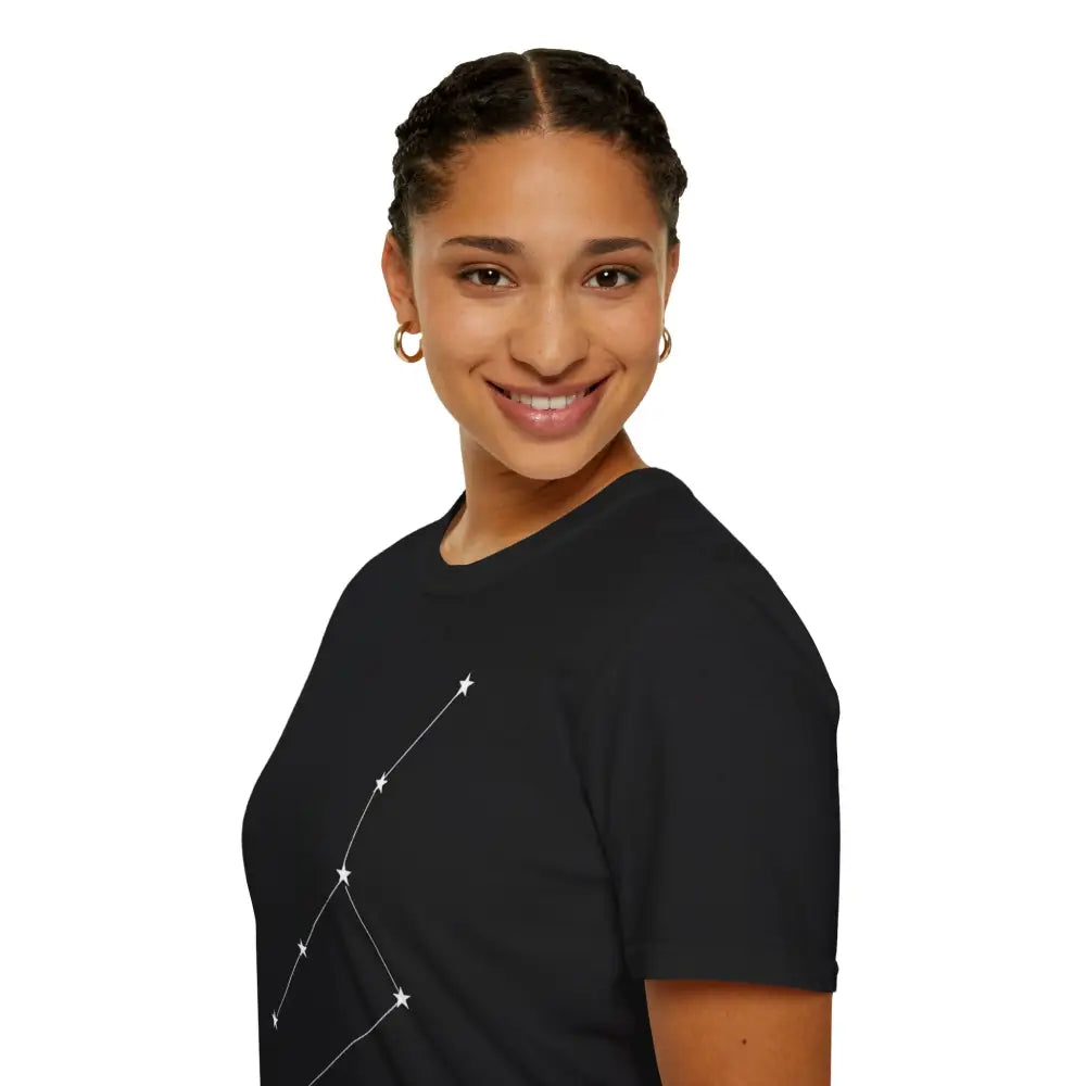 Woman with braided hair and hoop earrings wearing a black unisex softstyle constellation T-shirt with star sign graphic