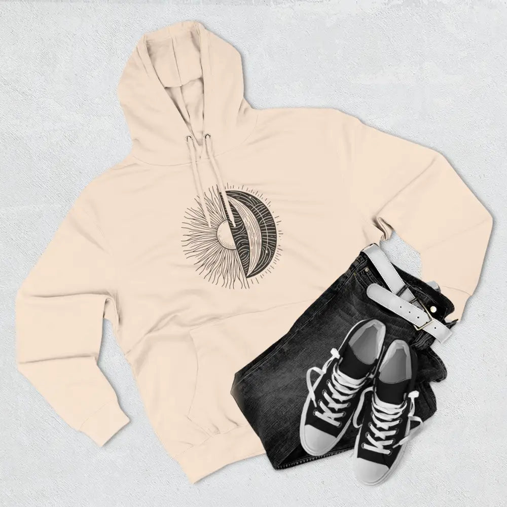 Cream-colored celestial hoodie with sun and moon graphic, cozy fleece with spacious kangaroo pocket