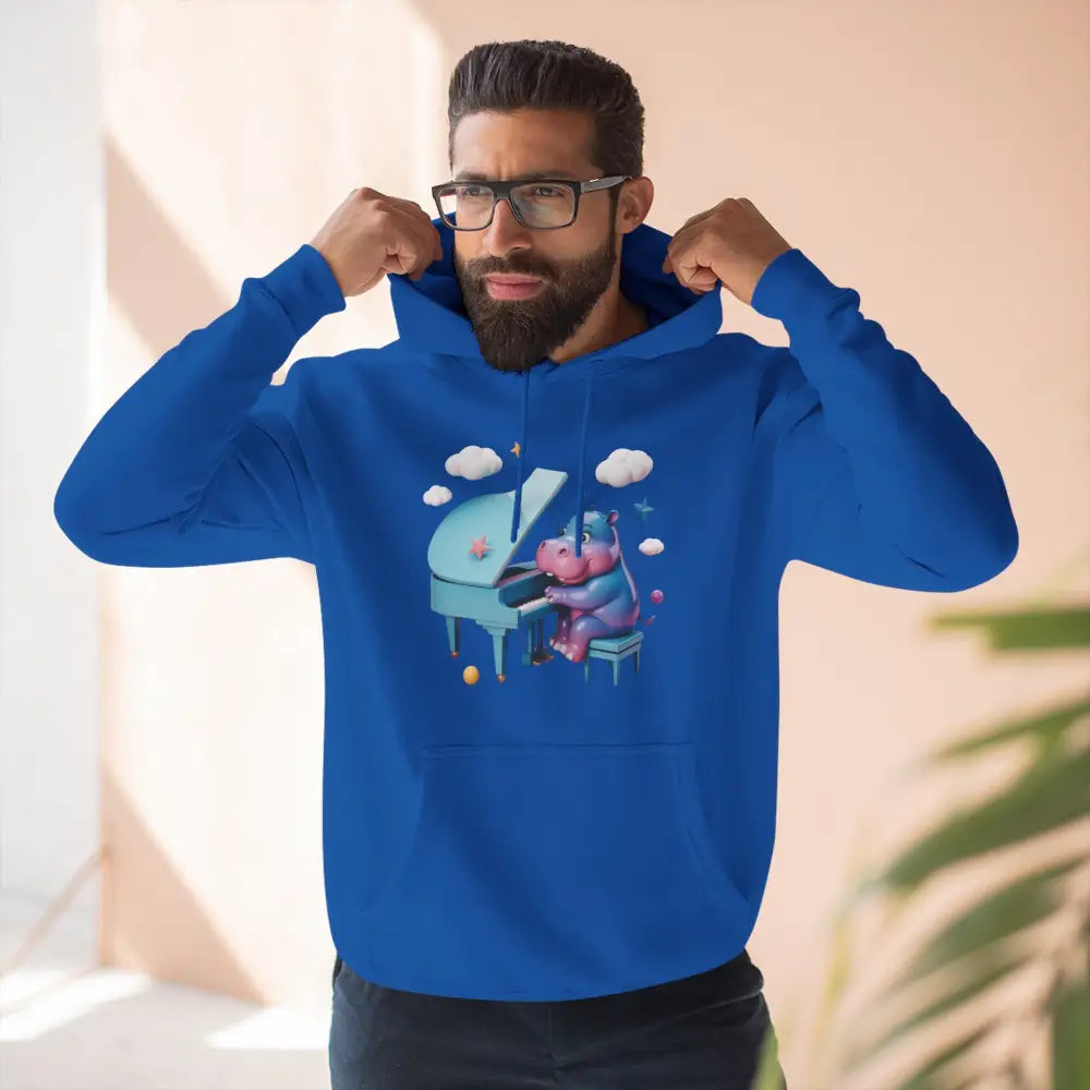 Man in royal blue fleece hoodie with a cartoon hippo playing piano, perfect gift for music lovers