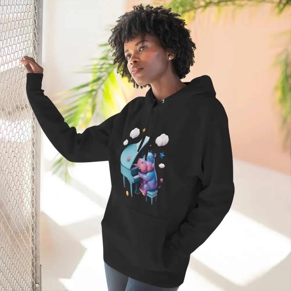 Black fleece hoodie with colorful cartoon hippopotamus playing piano, cozy and delightful fleece hoodie for kids and teens