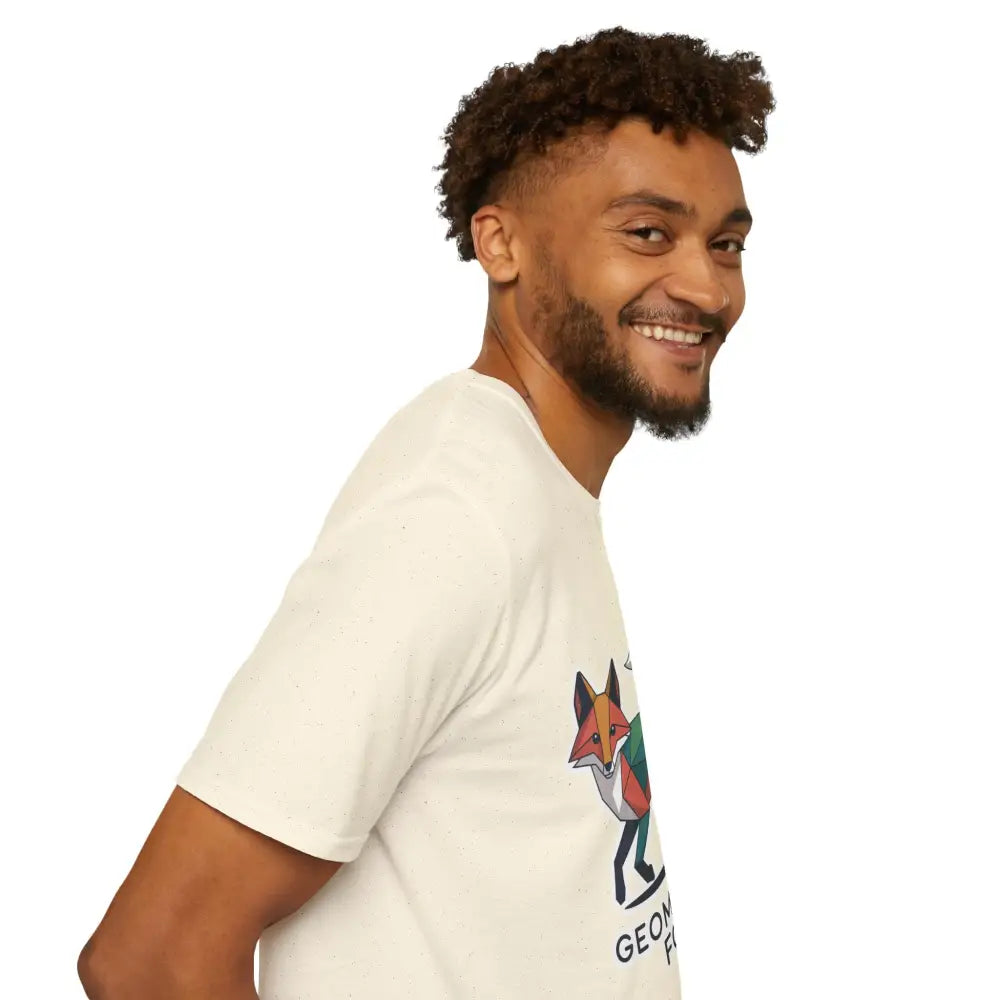 Smiling man wearing a cream-colored unique geometric fox unisex softstyle T-shirt for Earth Day