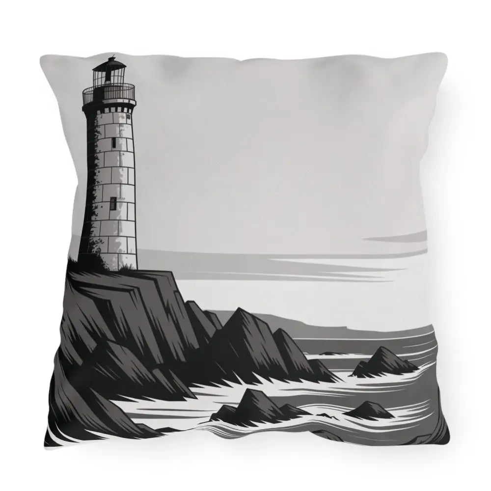Decorative outdoor pillow with black and white lighthouse and rocky seascape design in vibrant colors