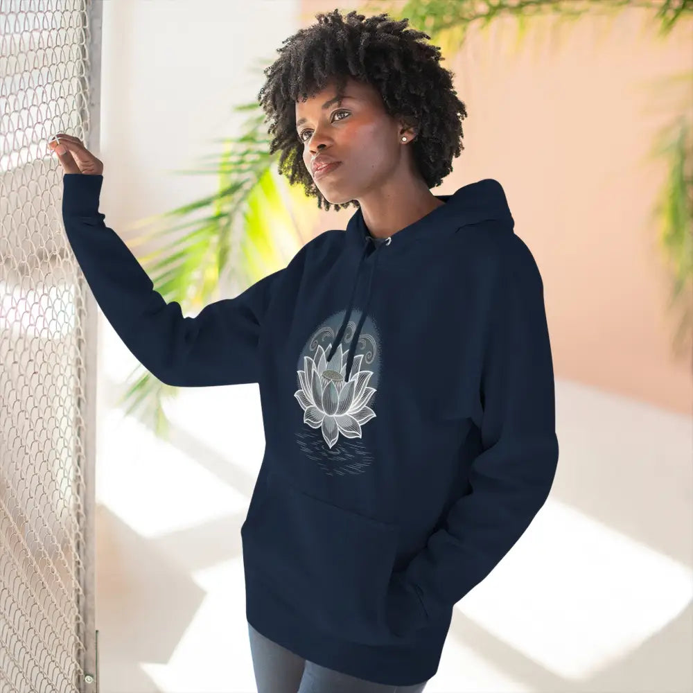 Woman wearing navy blue lotus design three-panel fleece hoodie with spacious kangaroo pocket