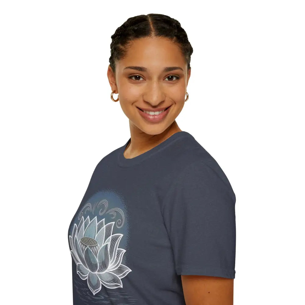Woman with braided hair wearing a dark blue unisex softstyle t-shirt with a white lotus flower design for yoga and mindfulness