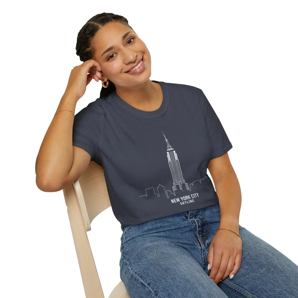 Woman wearing a dark blue unisex softstyle t-shirt with NYC skyline graphic and ribbed collar