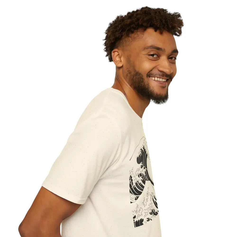 Man wearing Ocean Wave unisex t-shirt with black wave design, relaxed fit, highly elastic ribbed fabric