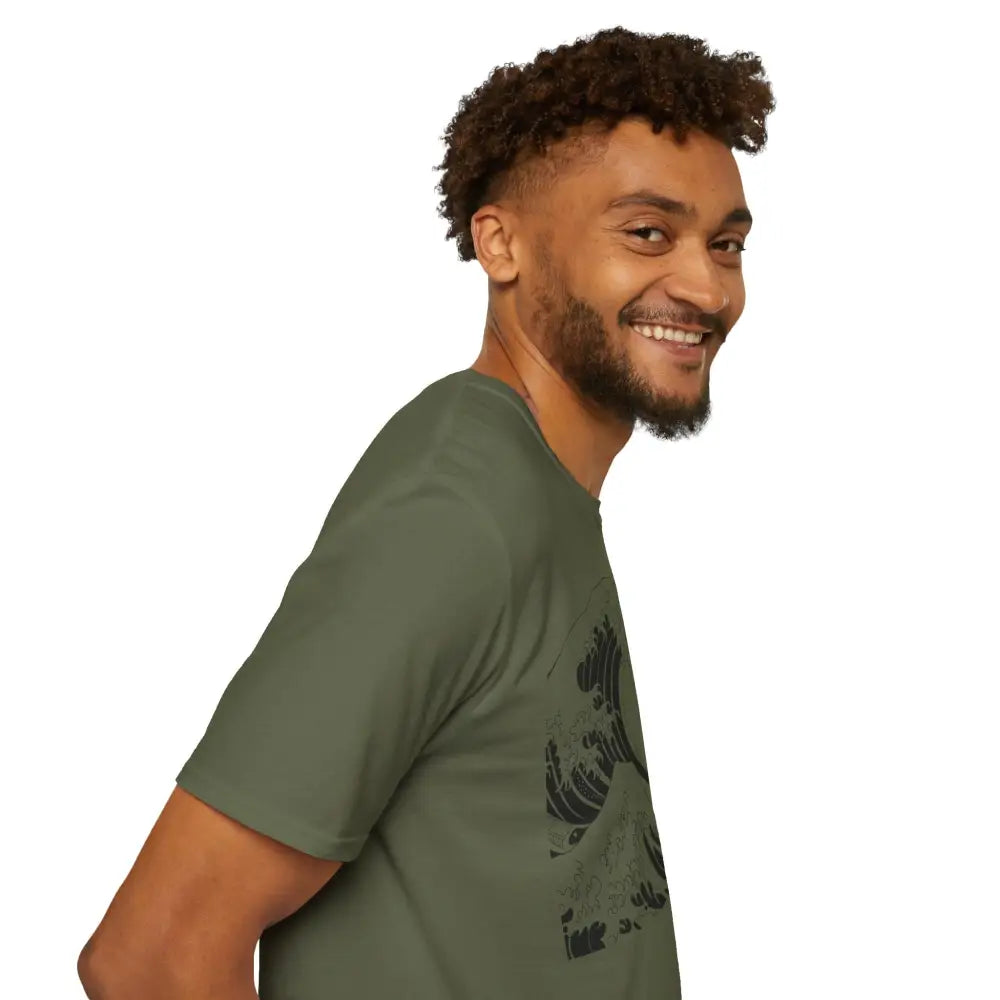 Smiling man in green Ocean Wave unisex t-shirt with highly elastic ribbed fabric