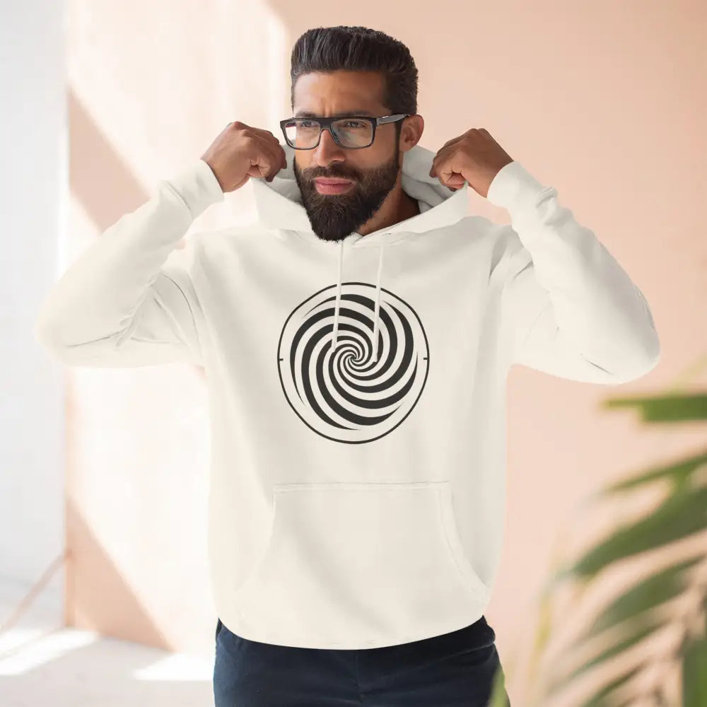Man wearing cream-colored fleece hoodie with black and white spiral design and spacious kangaroo pocket