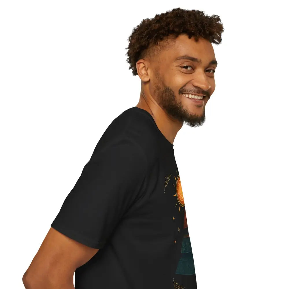 Smiling man wearing Stylish Pyramid Graphic Tee with colorful sun and moon design, low heat care instructions