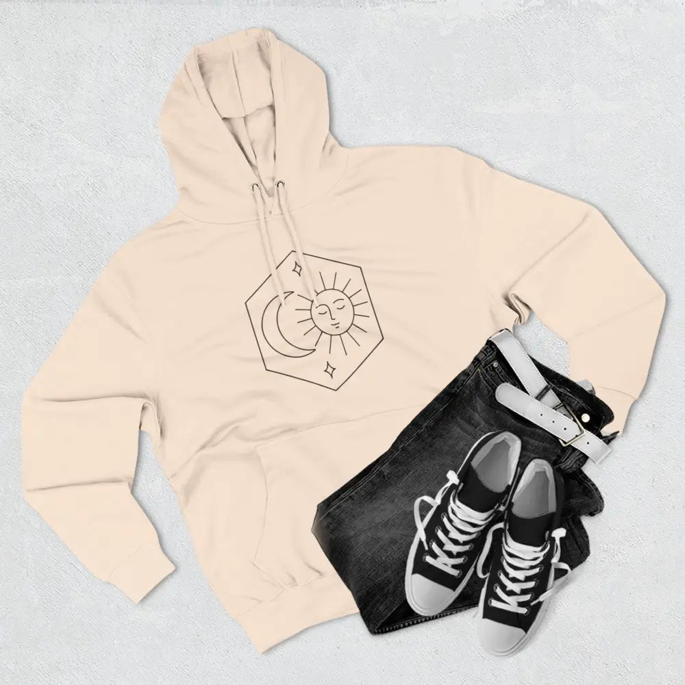 Light peach-colored fleece hoodie with black sun and moon celestial graphic for cozy fleece warmth