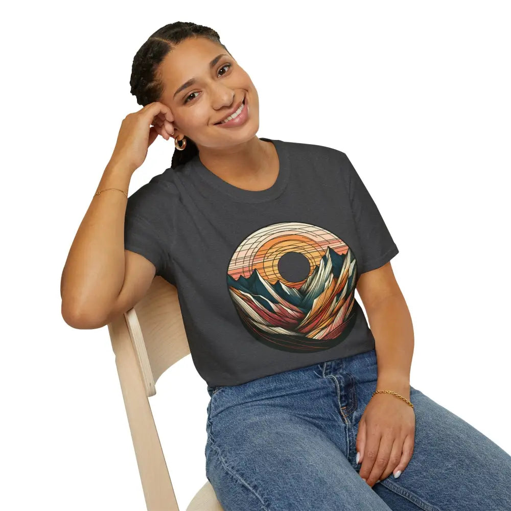 Woman wearing a vintage mountain vibes softstyle t-shirt with elastic ribbed collar and colorful sunset graphic