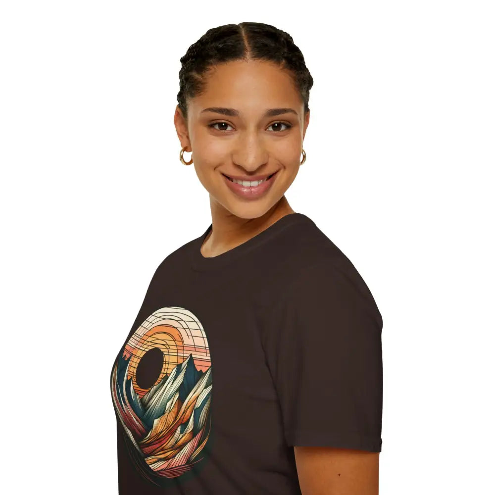 Woman wearing a vintage mountain vibes softstyle t-shirt with colorful sunset graphic