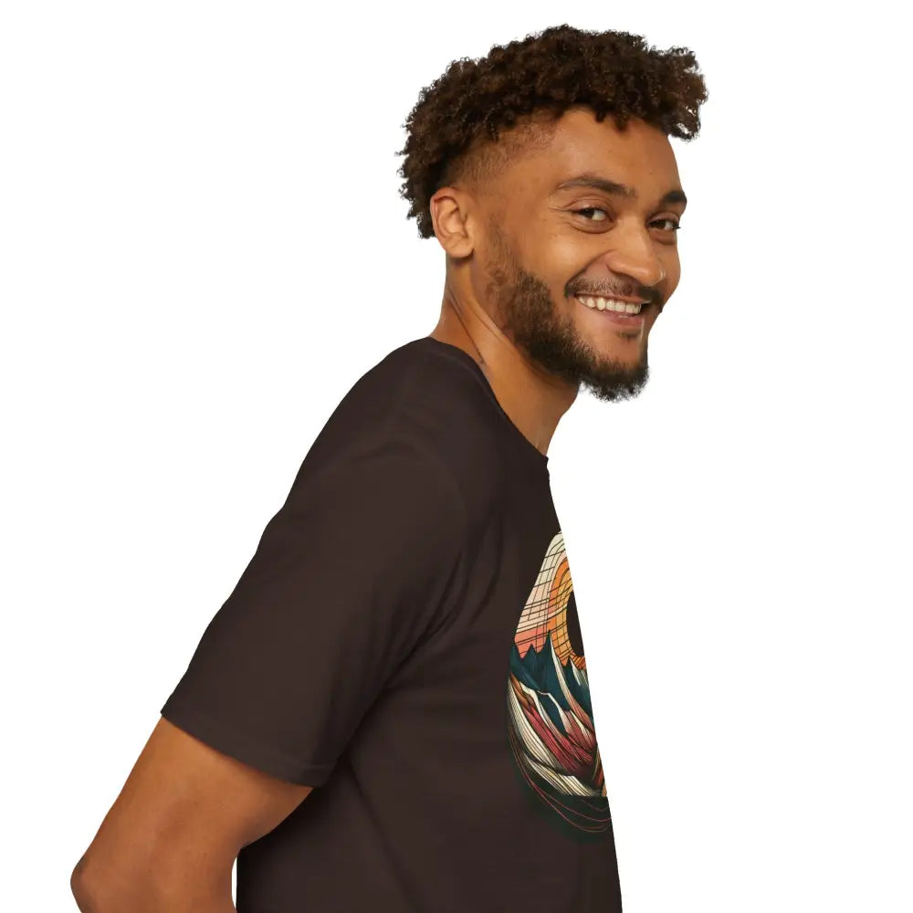 Man wearing a vintage mountain vibes softstyle t-shirt with colorful graphic design and elastic ribbed collar