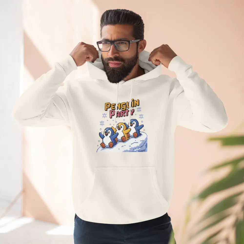 Man wearing a white hoodie with Penguin Party graphic in cozy fleece for winter and holiday fun